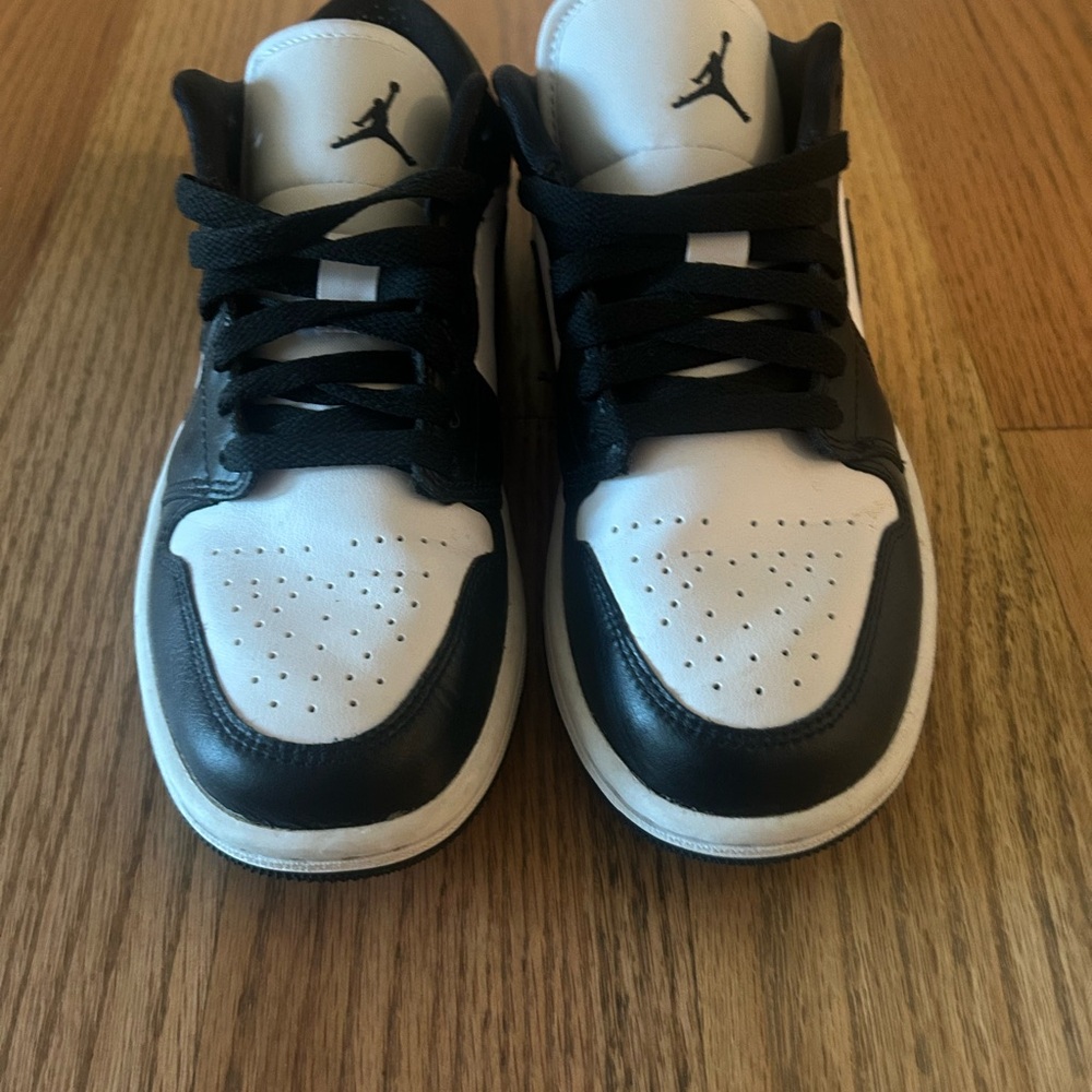 Woman’s Black and White Jordan ones